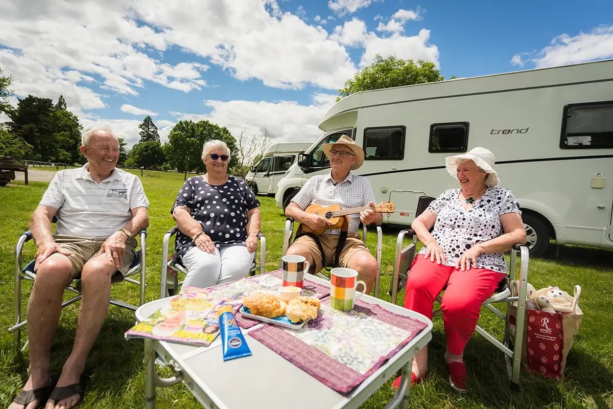A group of older people travelling with their RVs